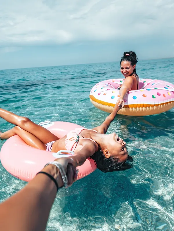 two-women-enjoying-the-pool-with-floats